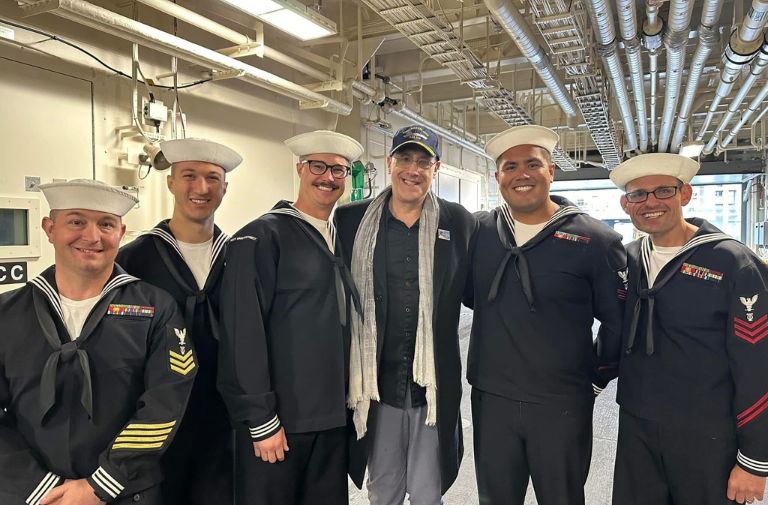 Stuart Milk (center) with service members aboard the USNS Harvey Milk. Photo via Facebook.